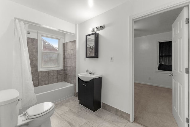 full bathroom featuring vanity, shower / bath combo, and toilet