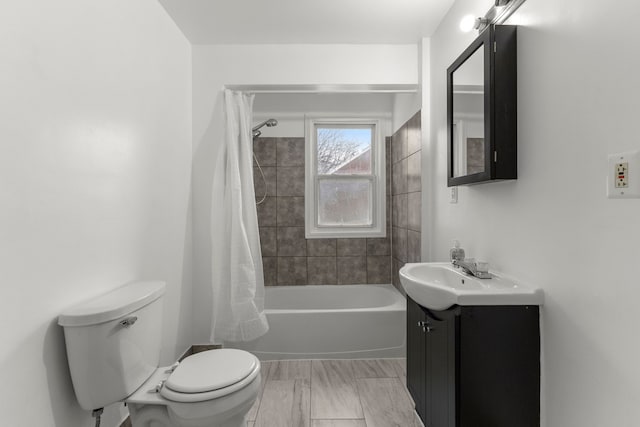 full bathroom with vanity, toilet, and shower / tub combo