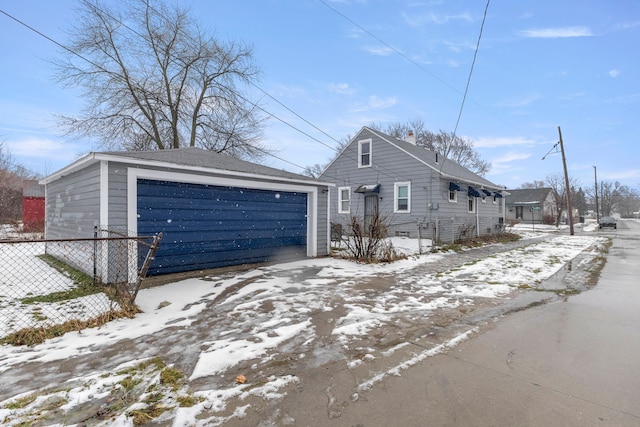 view of front facade featuring an outbuilding and a garage