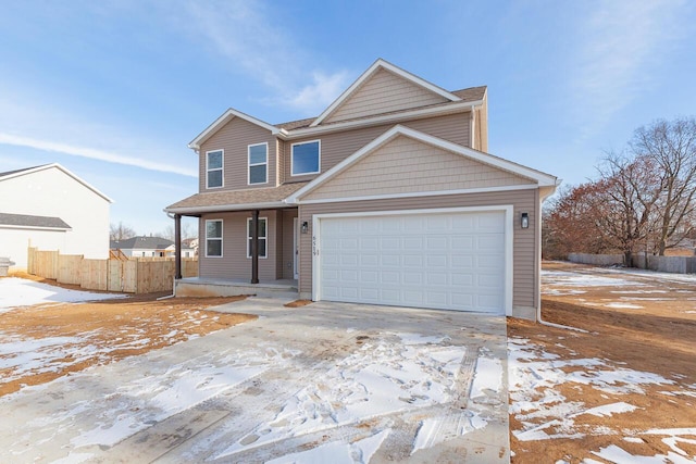 view of front of home with a garage and a porch