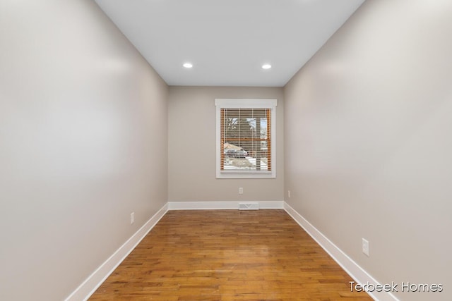 unfurnished room with light hardwood / wood-style floors