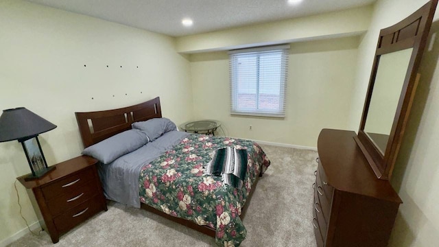 bedroom featuring light carpet