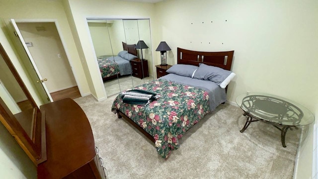 carpeted bedroom with a closet