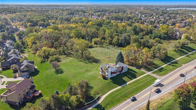 birds eye view of property featuring a wooded view