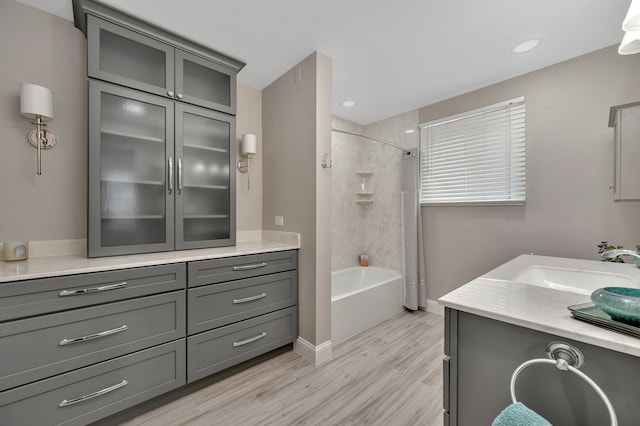 1611 Harwood Dr, Oxford, MI 48371 - bathroom with vanity, wood finished floors, and bathtub / shower combination