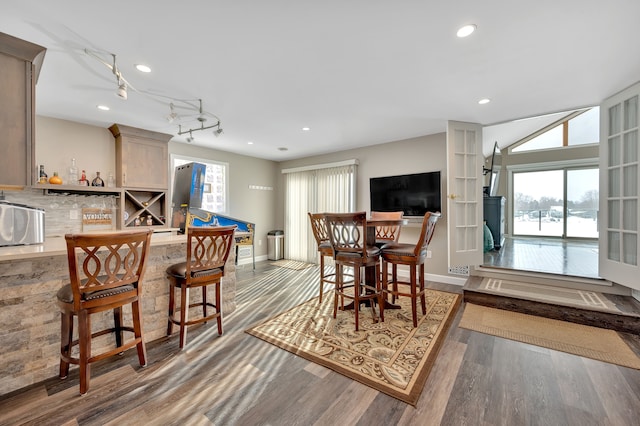 1611 Harwood Dr, Oxford, MI 48371 - dining room with wood finished floors, a bar, and recessed lighting