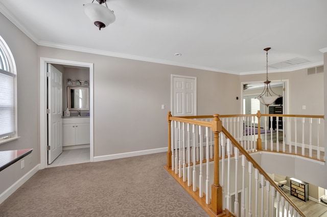 1611 Harwood Dr, Oxford, MI 48371 - corridor with an upstairs landing, healthy amount of natural light, crown molding, and light colored carpet