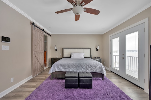 1611 Harwood Dr, Oxford, MI 48371 - bedroom featuring access to exterior, a barn door, french doors, ornamental molding, and light wood-style flooring