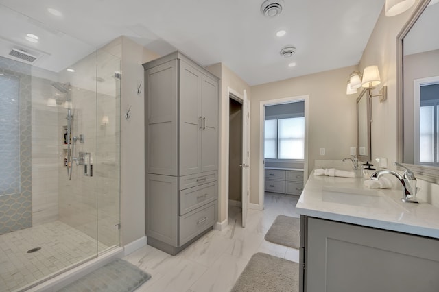 1611 Harwood Dr, Oxford, MI 48371 - bathroom with a stall shower, double vanity, a closet, marble finish floors, and recessed lighting