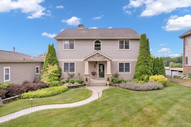 1611 Harwood Dr, Oxford, MI 48371 - view of front facade with a front lawn and a chimney