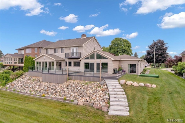 1611 Harwood Dr, Oxford, MI 48371 - back of property featuring a balcony, a chimney, a yard, and a patio area
