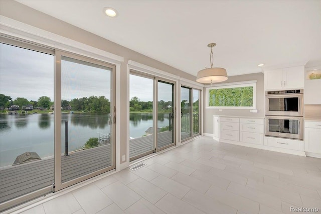 1611 Harwood Dr, Oxford, MI 48371 - unfurnished sunroom with a water view