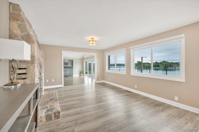 1611 Harwood Dr, Oxford, MI 48371 - unfurnished living room with light wood finished floors and baseboards