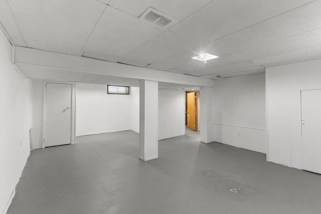 basement featuring a drop ceiling