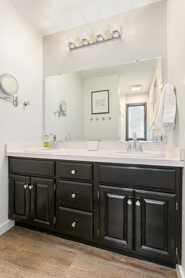 bathroom with vanity and hardwood / wood-style floors