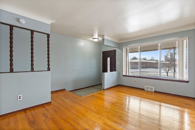 spare room featuring light hardwood / wood-style floors