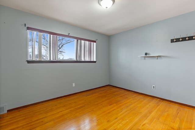 unfurnished room featuring wood-type flooring