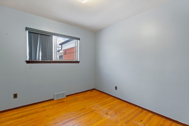 empty room with light wood-type flooring