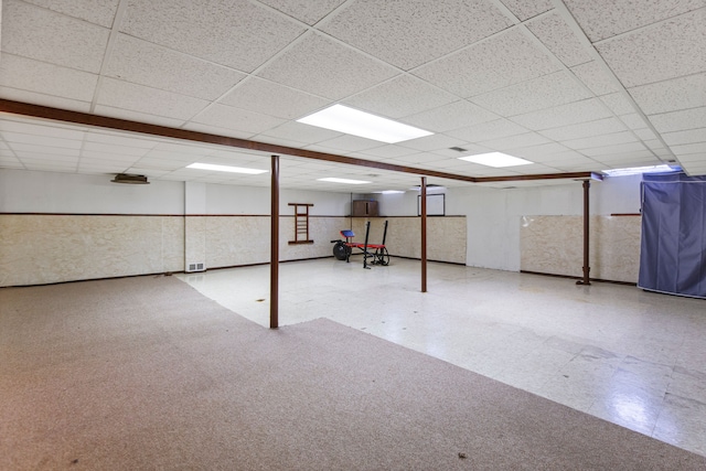 basement featuring a drop ceiling