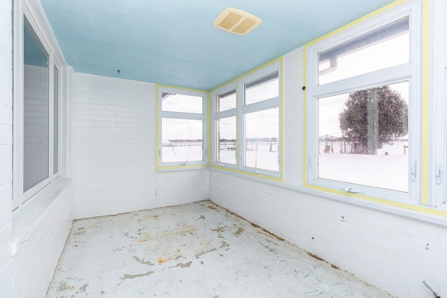 unfurnished sunroom with visible vents