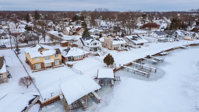 snowy aerial view featuring a residential view