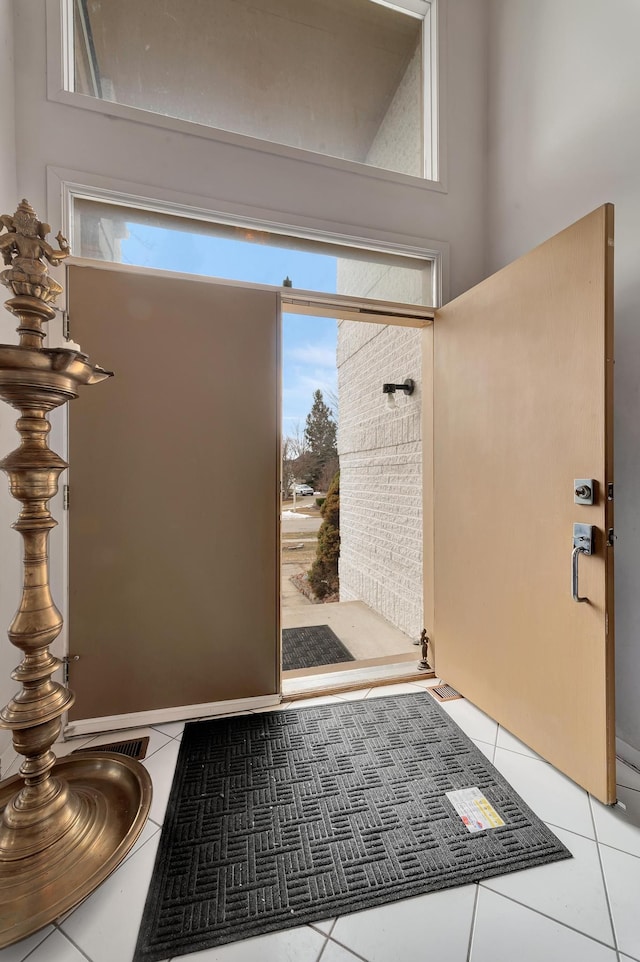 entryway featuring light tile patterned flooring