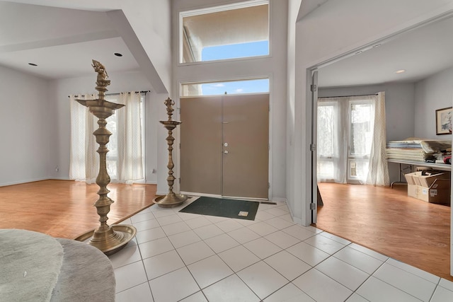 entryway with light tile patterned floors