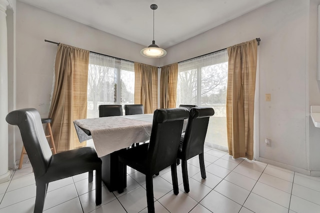 dining area featuring light tile patterned floors