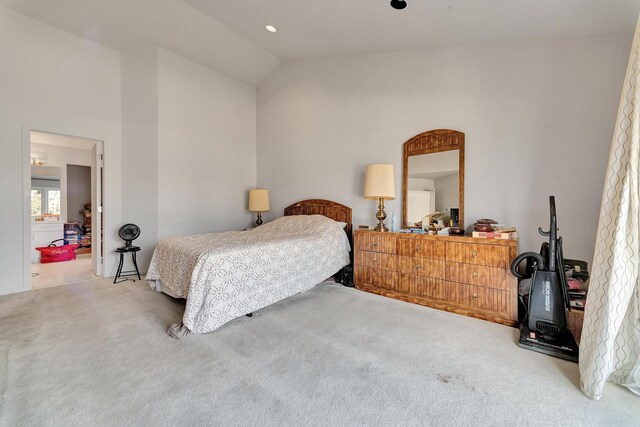 bedroom with carpet flooring and vaulted ceiling