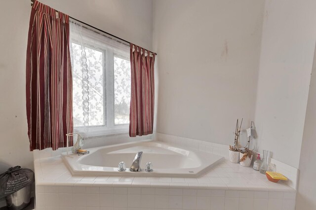 bathroom with a garden tub