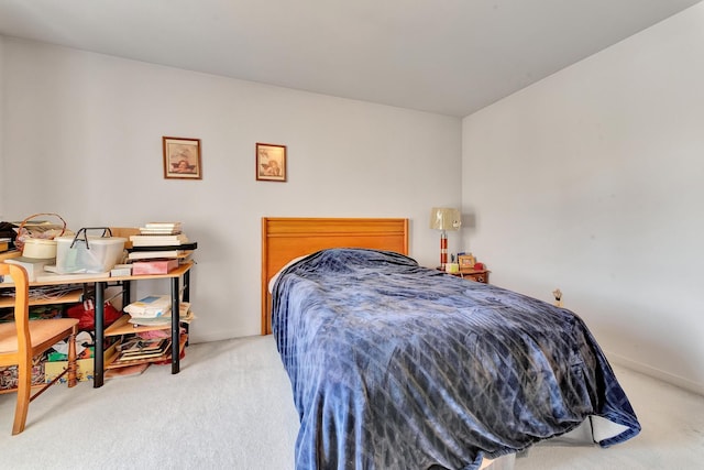 carpeted bedroom with baseboards