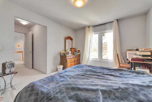 bedroom featuring baseboards and carpet floors