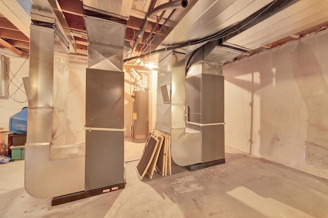 unfinished basement with water heater and heating unit