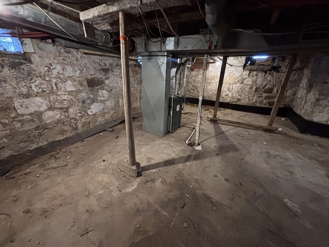 basement featuring heating unit