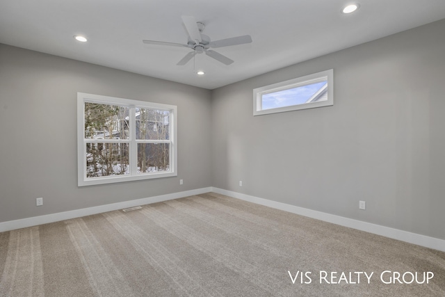 empty room with recessed lighting and baseboards