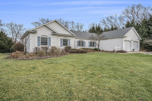 ranch-style house with a garage and a front yard