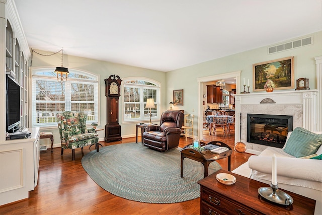 living room featuring a fireplace and hardwood / wood-style floors