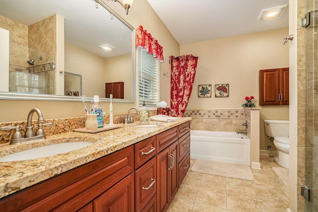 full bathroom with tile patterned flooring, vanity, shower with separate bathtub, and toilet