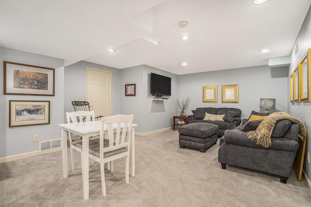 living room featuring light carpet