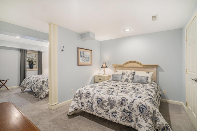 bedroom with light carpet