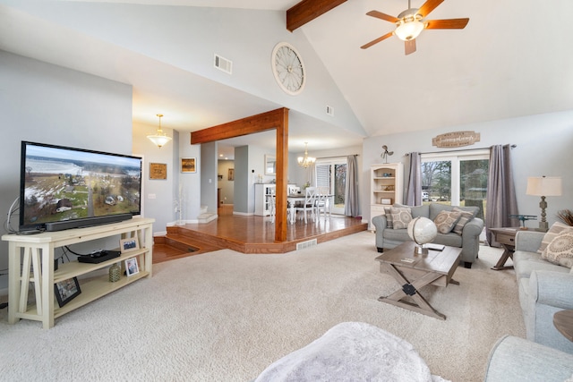 living room with beam ceiling, ceiling fan with notable chandelier, high vaulted ceiling, and carpet flooring