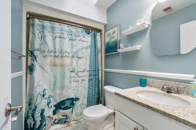 bathroom featuring a shower with curtain, tile patterned floors, vanity, and toilet