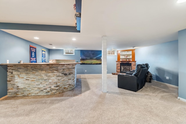 carpeted living room with indoor bar and a fireplace