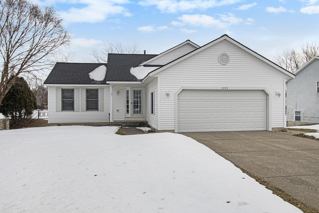 view of front of home with a garage