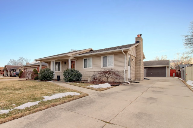 ranch-style home featuring a garage and a front yard