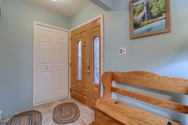 foyer featuring light tile patterned flooring