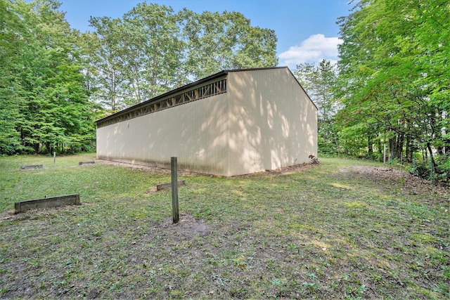 4348 S Grandview Hwy, Harrietta, MI 49638 - view of side of home with an outbuilding and a yard