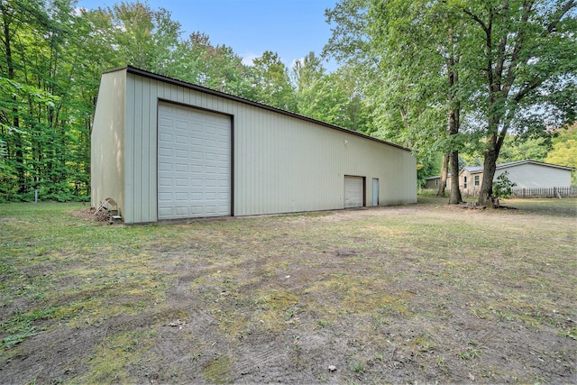 4348 S Grandview Hwy, Harrietta, MI 49638 - view of outbuilding featuring a garage and a yard