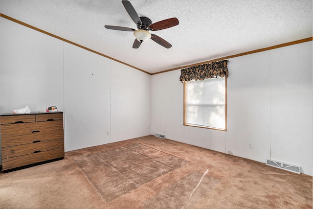 4348 S Grandview Hwy, Harrietta, MI 49638 - spare room with vaulted ceiling, a textured ceiling, ornamental molding, carpet flooring, and ceiling fan
