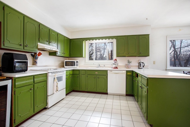 kitchen featuring sink, white appliances, green cabinets, wine cooler, and light tile patterned flooring